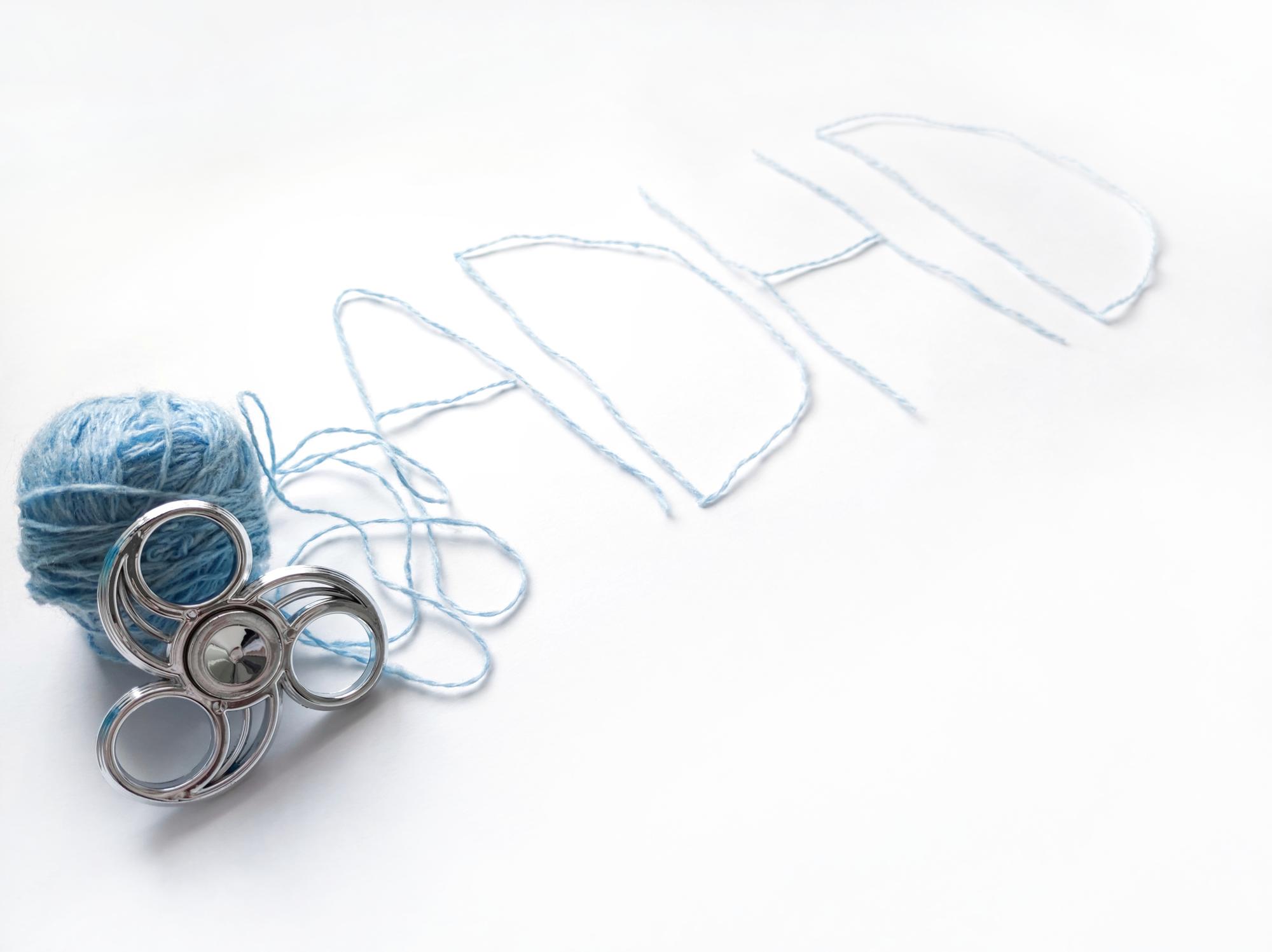 Studio table with threads, hoops and sketches