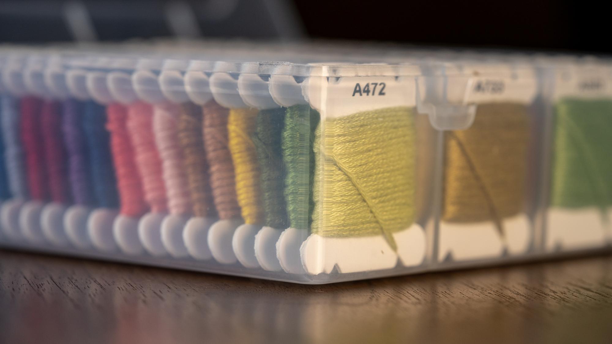 Assorted embroidered swatches on table